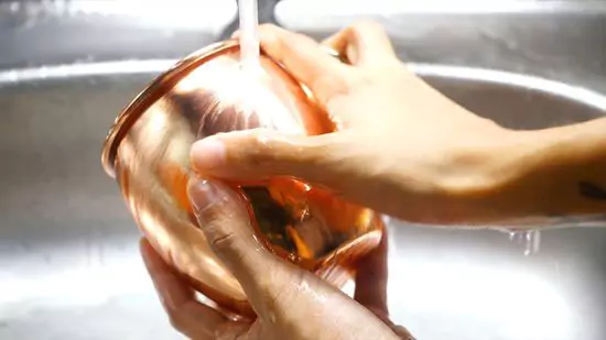 Wash copper utensils by hand